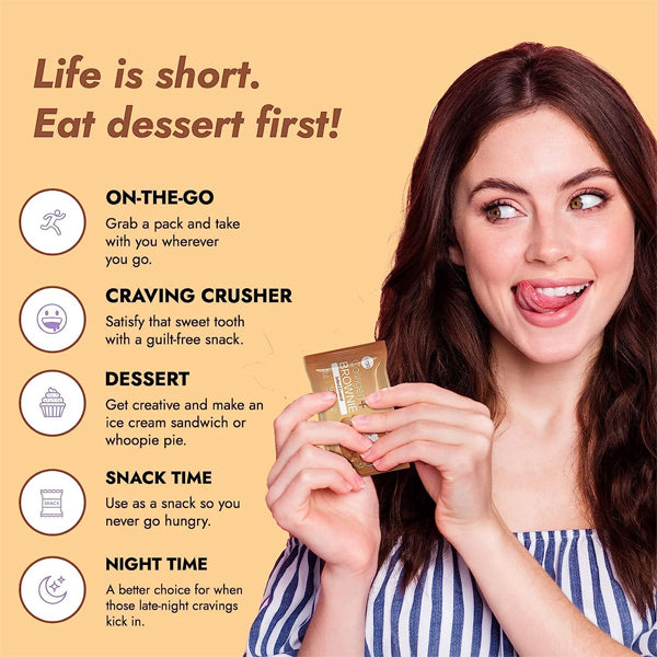 Person enjoying collagen protein brownies as a healthy snack