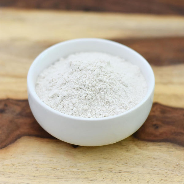 Close-up of finely ground buckwheat flour on a wooden spoon