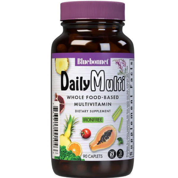 Bluebonnet Daily Plant-Based Multivitamin Capsules in a natural setting, showcasing the bottle with herbs.