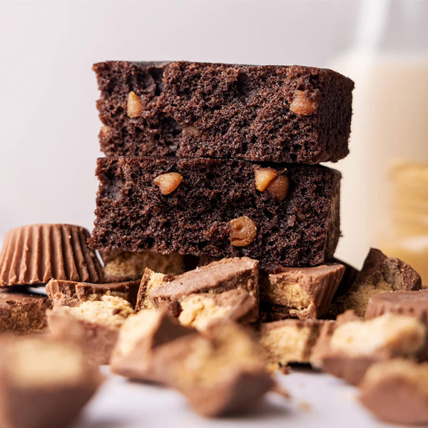 High protein brownies on a plate, showcasing their rich chocolate texture.
