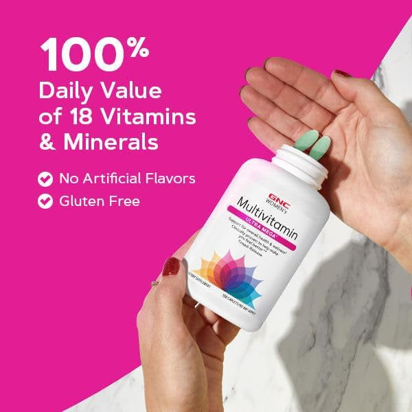 A woman smiling while taking VitaBoost Womens Ultra Mega Multivitamin, representing wellness and vitality.