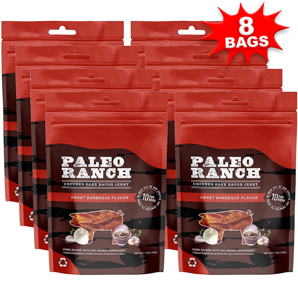 Hand holding a piece of bacon jerky with a backdrop of outdoor scenery, ideal for on-the-go snacking