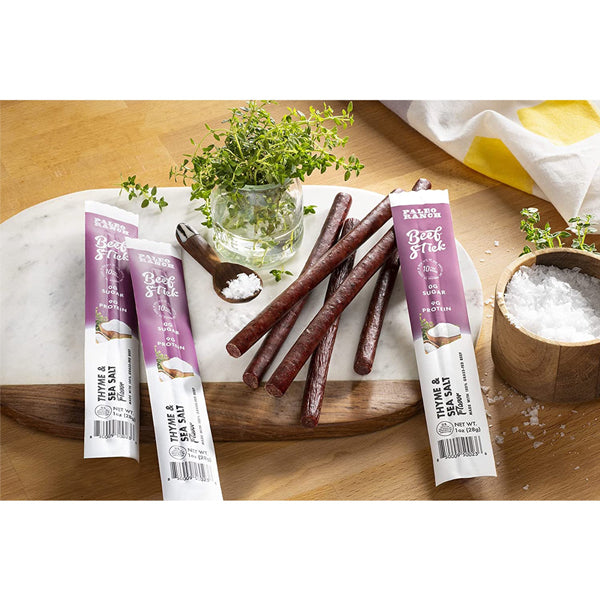 Athlete enjoying Paleo Ranch beef jerky sticks during workout for high-protein recovery