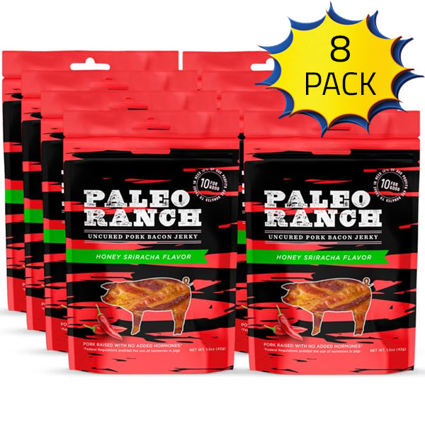 Paleo Ranch uncured pork bacon jerky slices on a wooden surface, highlighting their flavor and texture