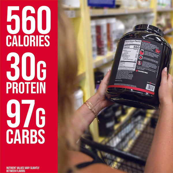 Athlete drinking a protein shake made with Rule1 lean muscle builder after workout