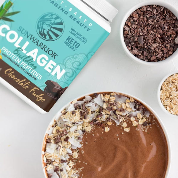 A scoop of Sun Warrior collagen powder being added to a smoothie, emphasizing its versatility.