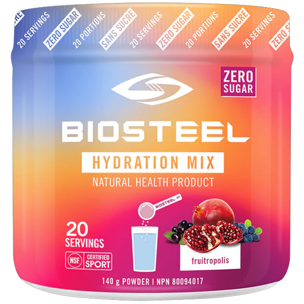 Athlete mixing electrolyte powder into water during workout for hydration