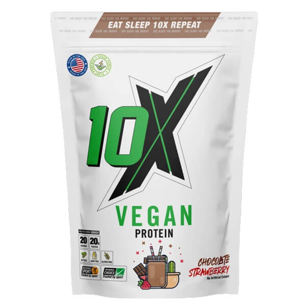 Scoop of 10X Performance Vegan Protein powder on a kitchen counter, showcasing its fine texture.