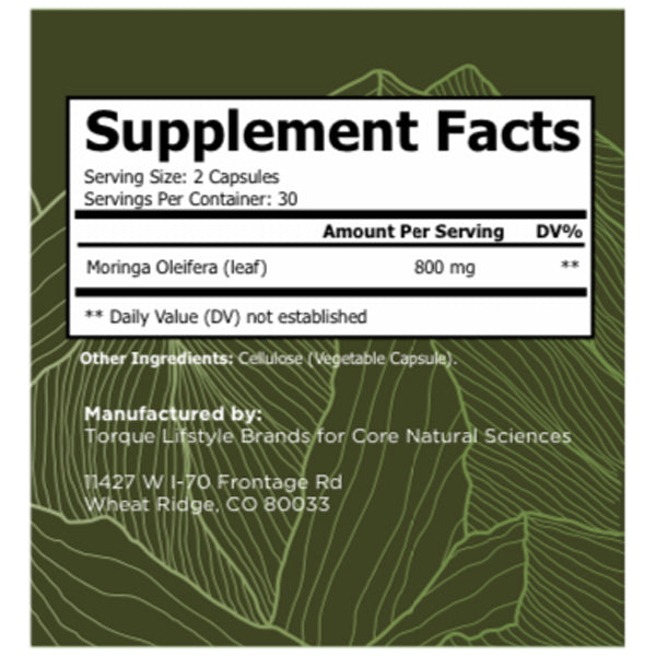 An individual holding a bottle of moringa capsules, highlighting their use for energy boost and wellness.