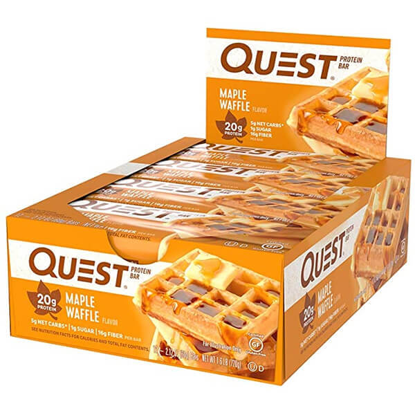 Close-up of a Quest Protein Bar, highlighting its texture and ingredients for a satisfying snack.