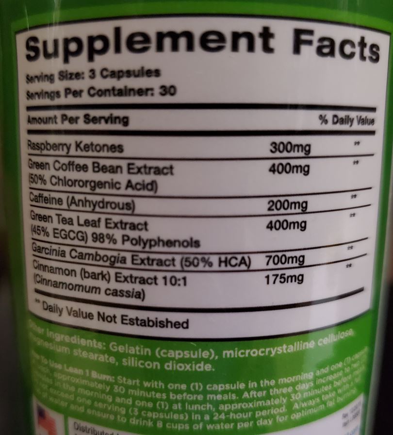 Close-up of the supplements ingredients, including raspberry ketones and garcinia cambogia, highlighting their natural weight loss properties.